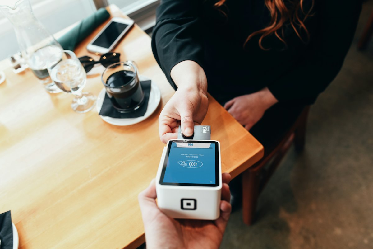 Customer paying by card on a payment terminal