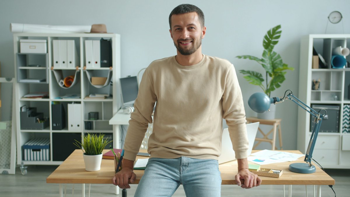Friendly advisor smiling in a bright office